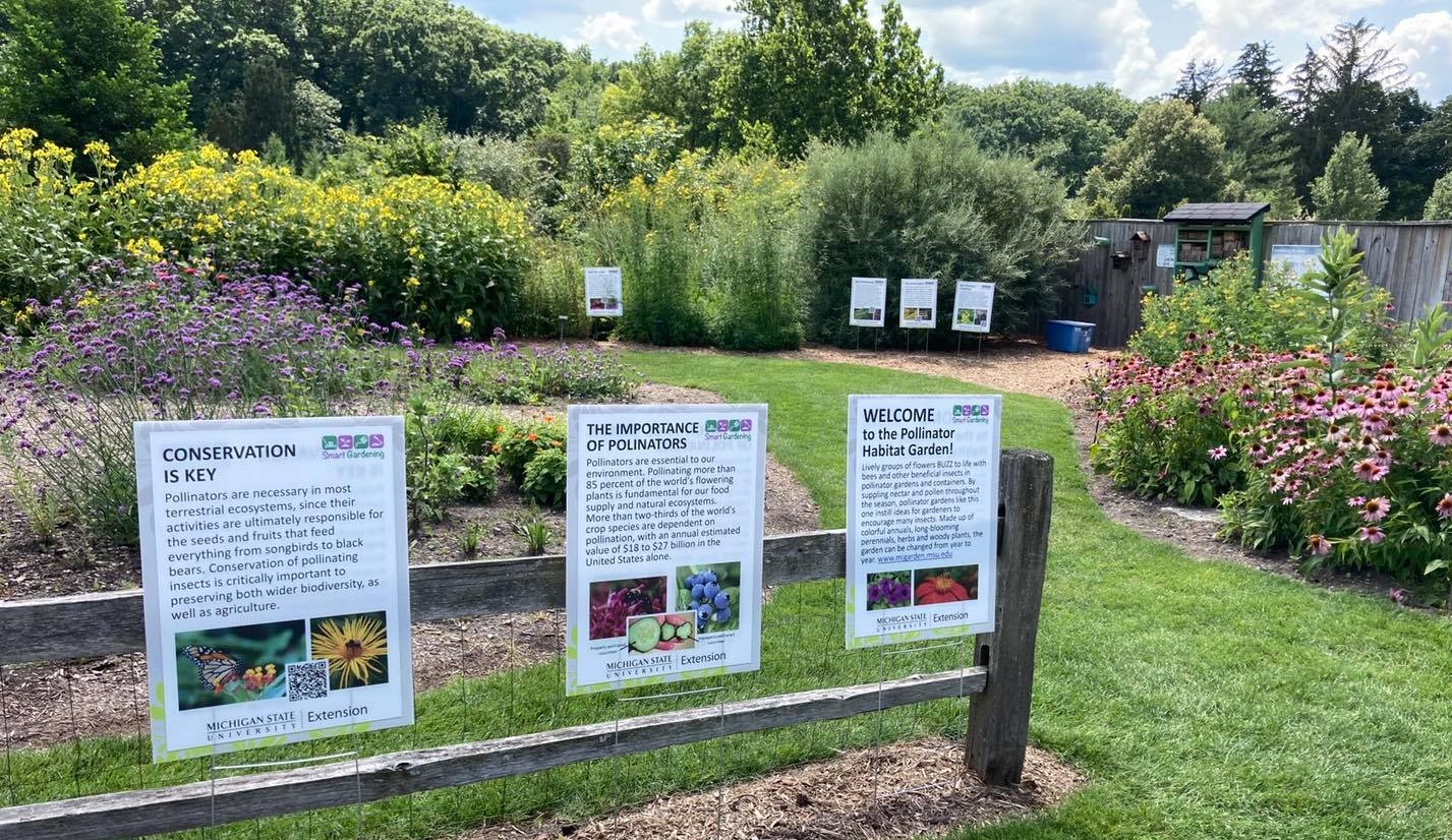 Smart Gardening signs in a garden.